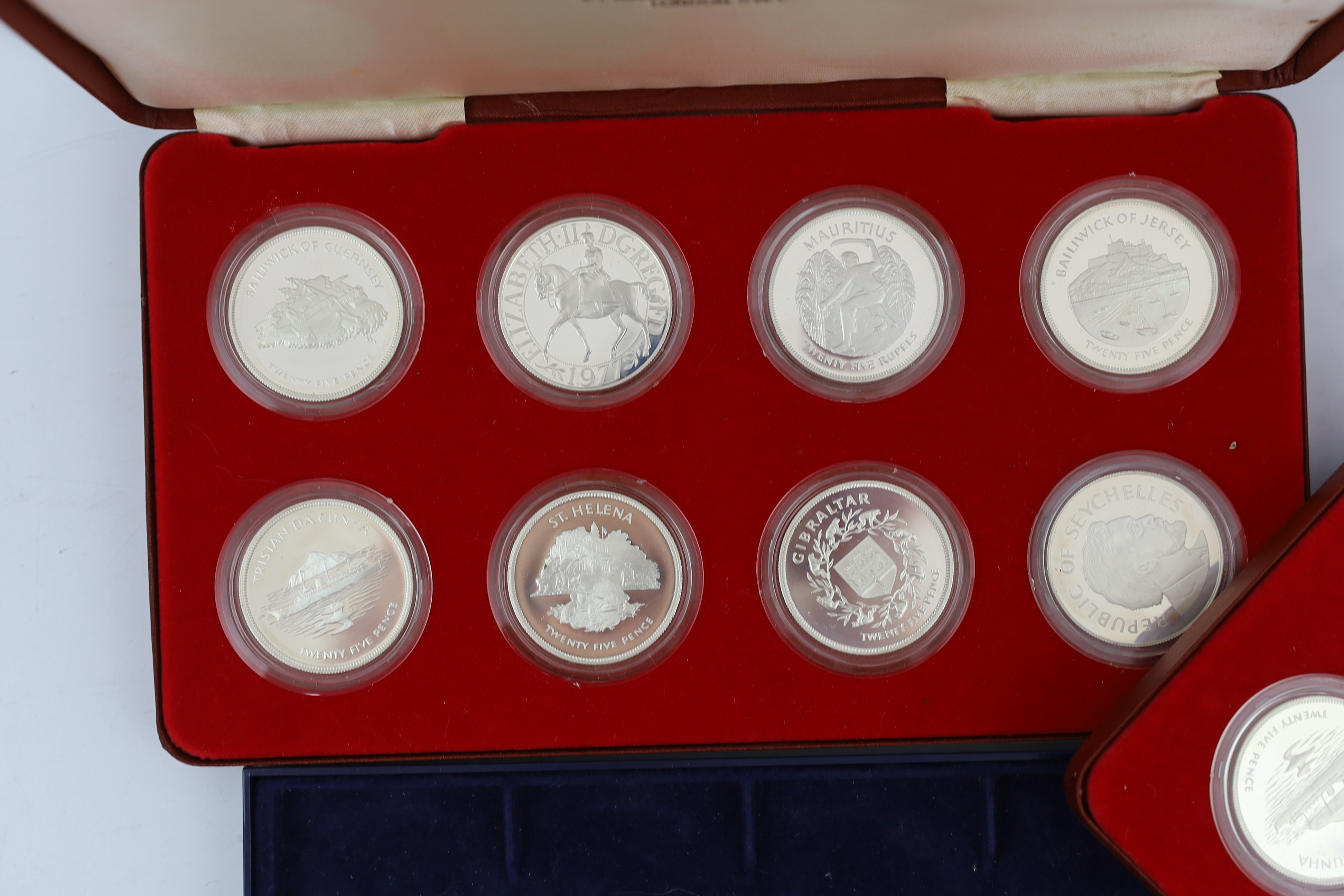 British proof silver coins, Three cased sets of eight crown pieces of the Commonwealth issued to commemorate the Queen's Silver Jubilee in 1977 and other commemorative crowns